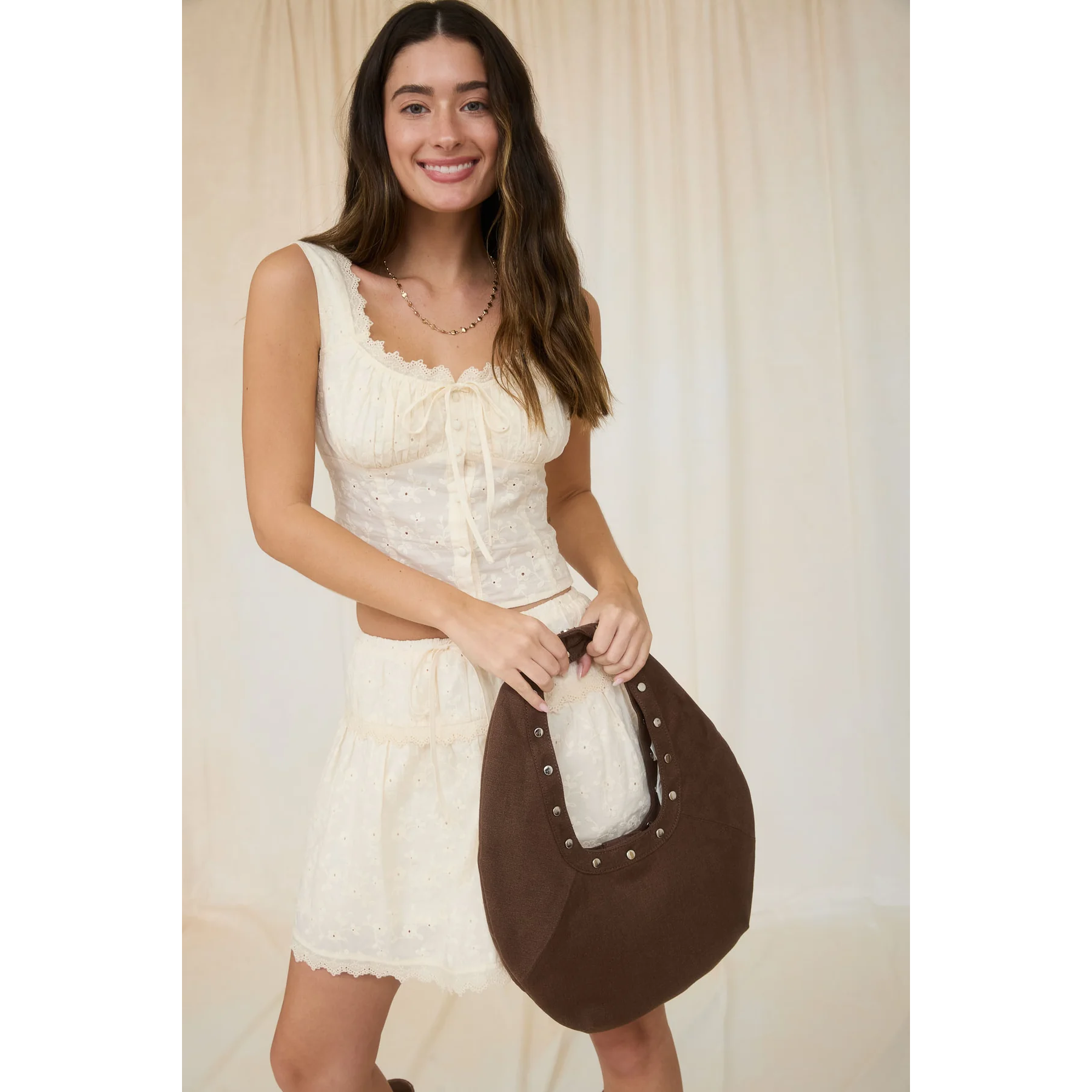 cream sleeveless eyelet top