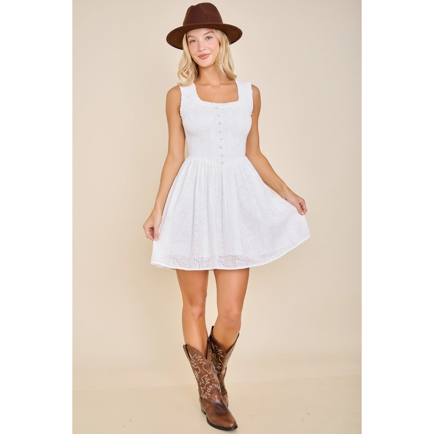 white sleeveless smocked mini dress