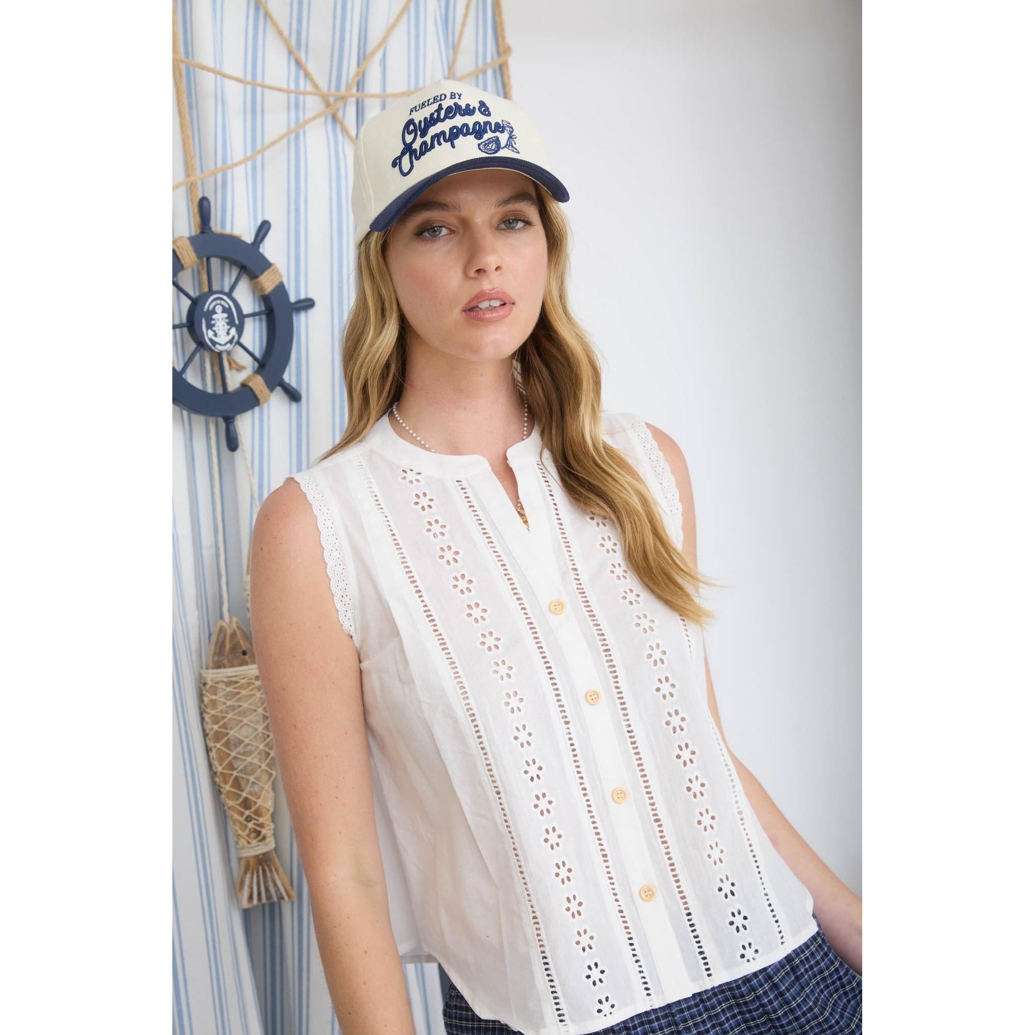 white eyelet sleeveless top with lace